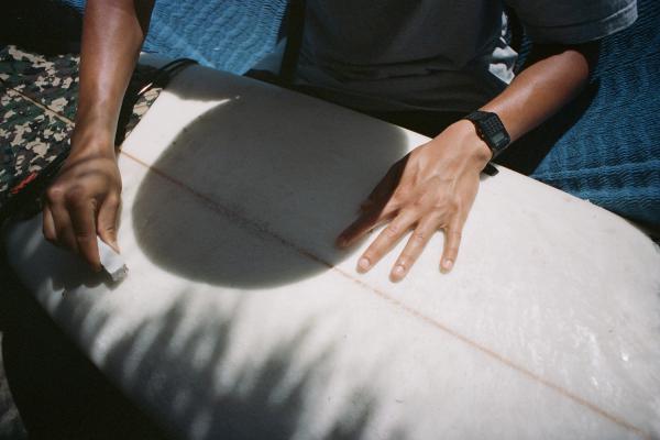 Waxing up the boards. Photo: Brian Kelley